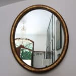 marius, le miroir ovale bois doré médaillon