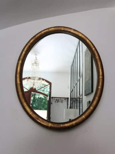 marius, le miroir ovale bois doré médaillon