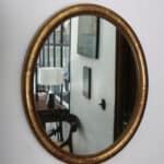 marius, le miroir ovale bois doré médaillon