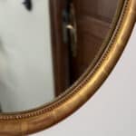 marius, le miroir ovale bois doré médaillon