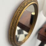 marius, le miroir ovale doré style napoléon iii